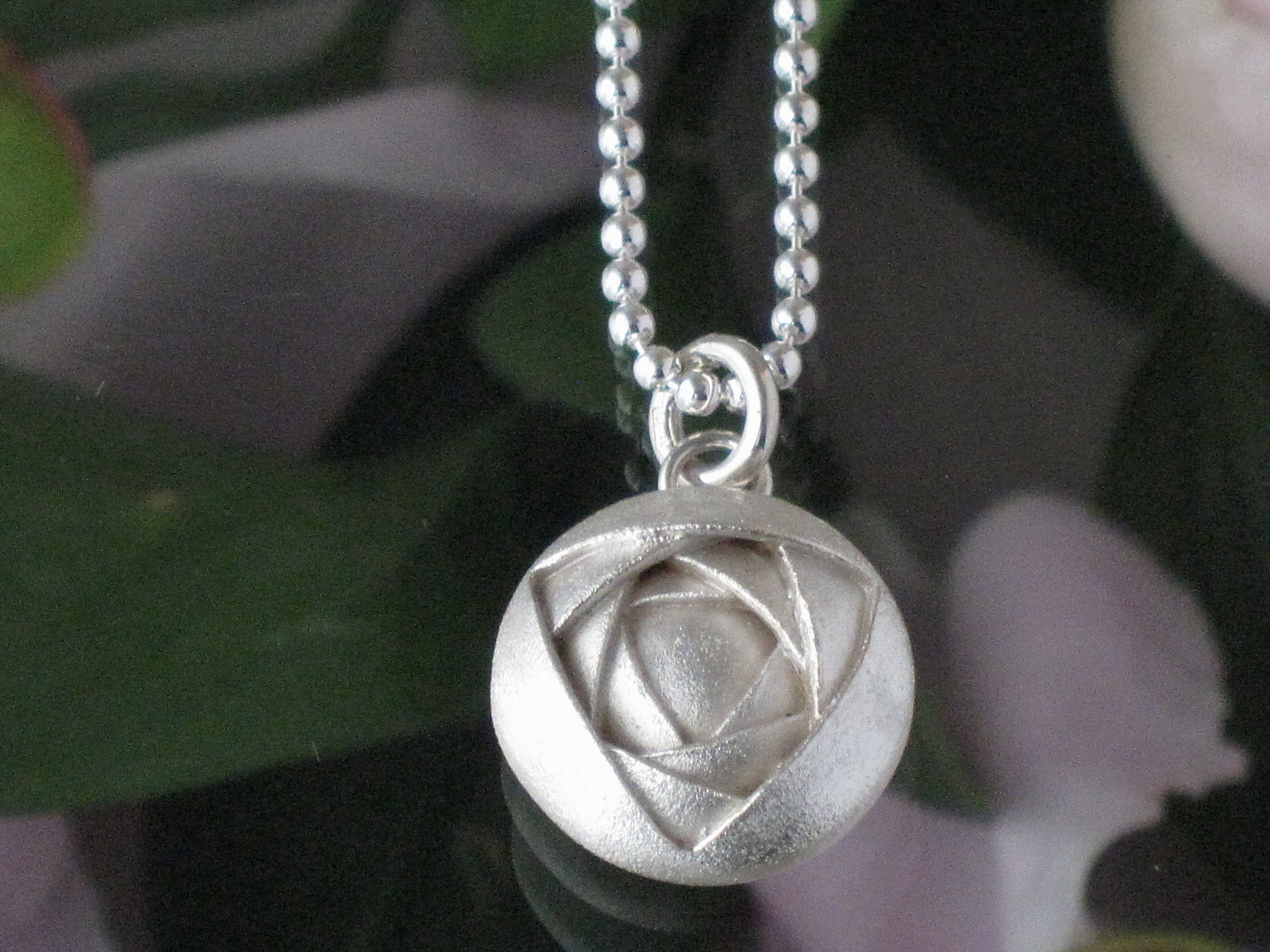 Peony handmade silver pendant design Taru Tonder. Finnish design.